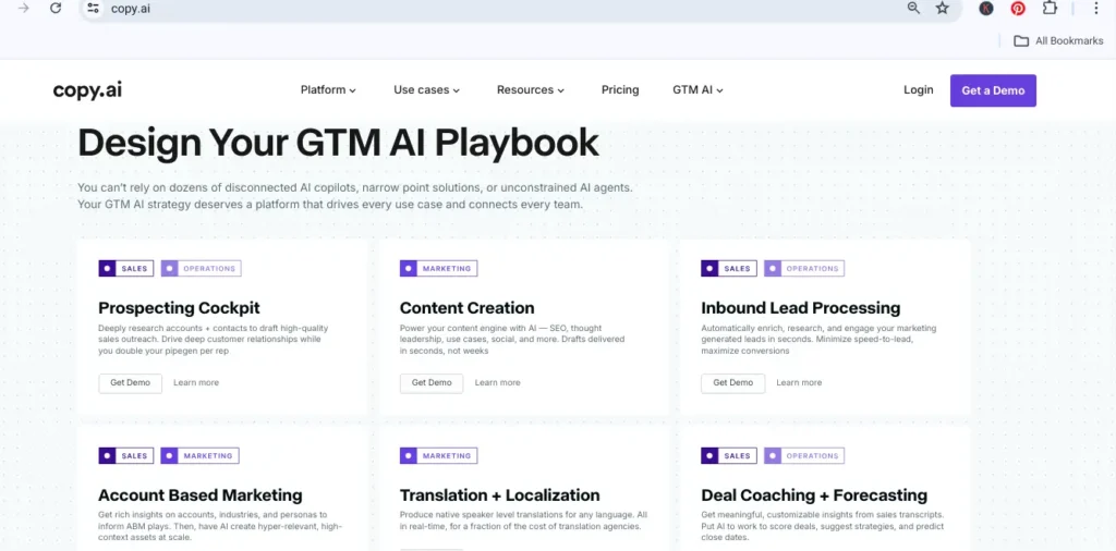 Screenshot of Copy.ai homepage showing GTM AI Playbook features including Prospecting Cockpit and Content Creation modules.